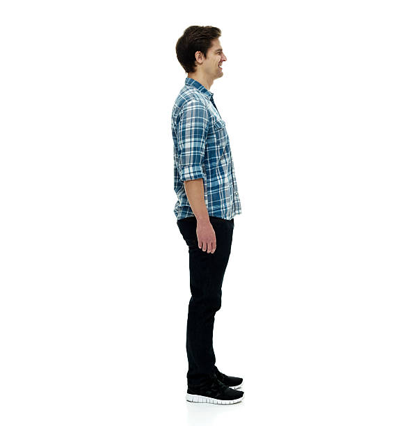 istock Smiling casual man standing and looking away 506518580