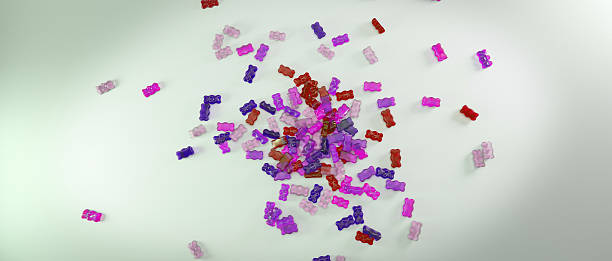 istock Transparent colorful sweet gummy bears falling background 506519394