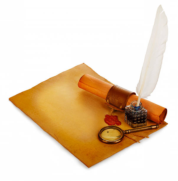 istock White feather, inkwell, loupe, ancient scroll with red wax seal. 506519504