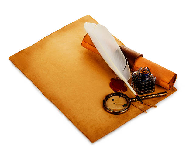 istock White feather, inkwell, loupe, ancient scroll with red wax seal. 506519564
