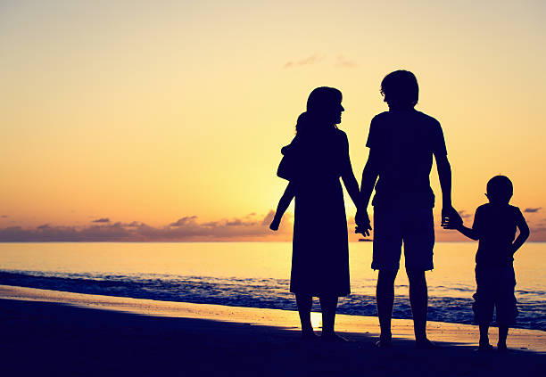 istock happy family with two kids on sunset beach 506520196