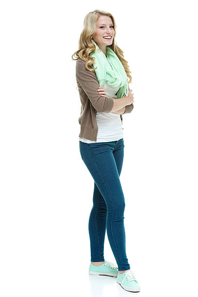 istock Cheerful female standing with arms crossed 506537159
