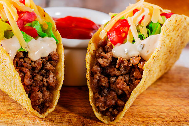 istock tacos with minced meat with greens and tomatoes 506538975