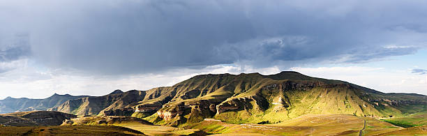 Long endless tarred road in the countryside at Golden Gate Highlands National Park, South Africa