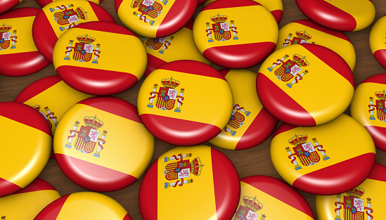 Spain flag on badges background image for Spanish national day events, holiday, memorial and celebration.