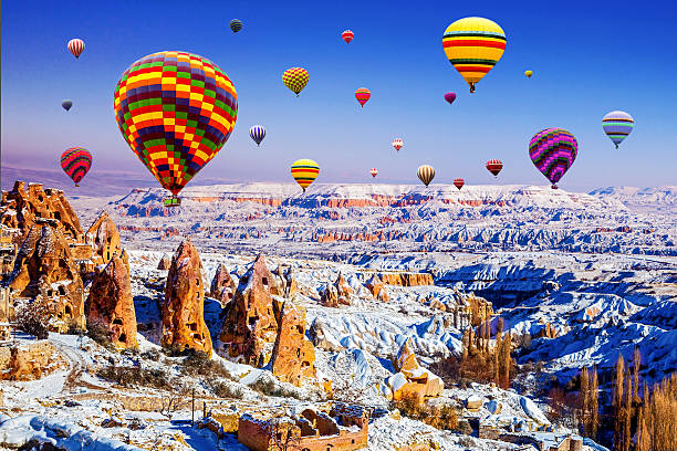 Cappadocia of winter in Turkey, with balloon Cappadocia under the snow cappadocia winter photos stock pictures, royalty-free photos & images