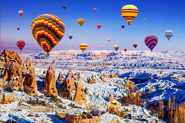 Cappadocia of winter in Turkey, with balloon Cappadocia under  the snow nevsehir stock pictures, royalty-free photos & images