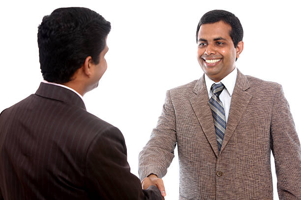 istock Two Indian business people shaking hands 506543636