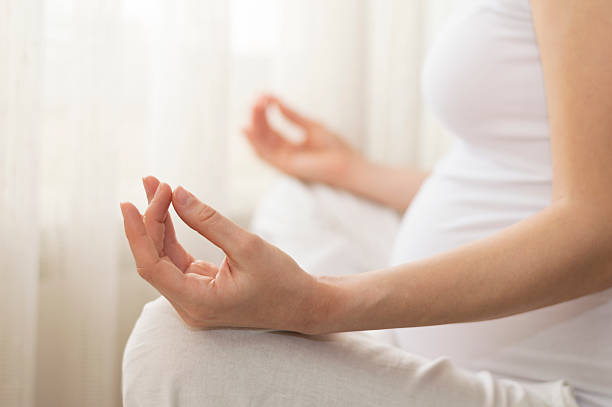 istock Pregnant woman doing yoga 506544404