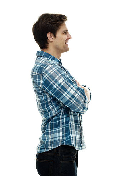 istock Smiling casual man standing with arms crossed 506546846