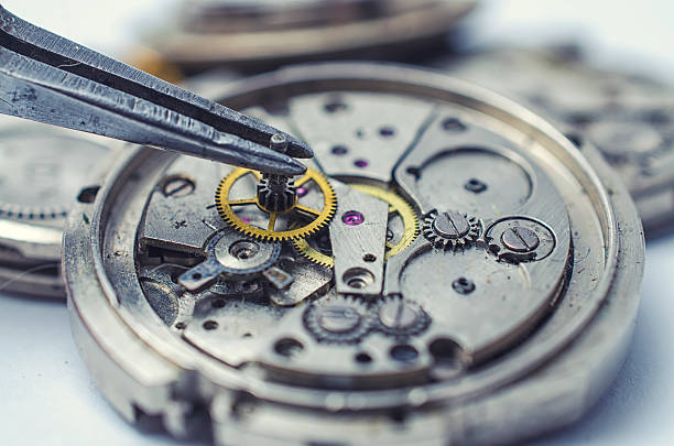 istock tweezers and disassembled mechanical watches 506546896