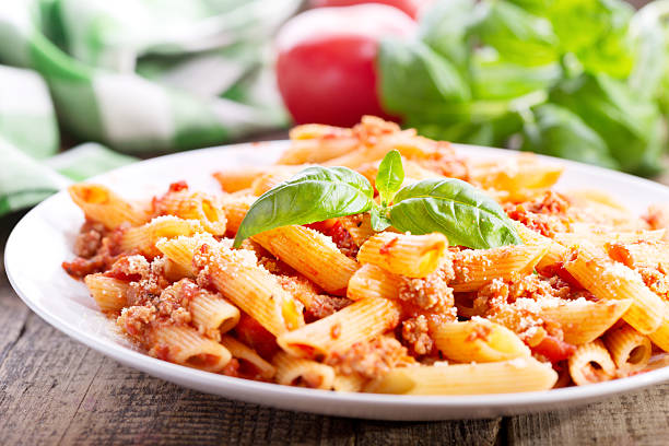 istock plate of penne pasta bolognese 506547802