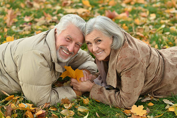istock Senior couple in autumn park 506548438