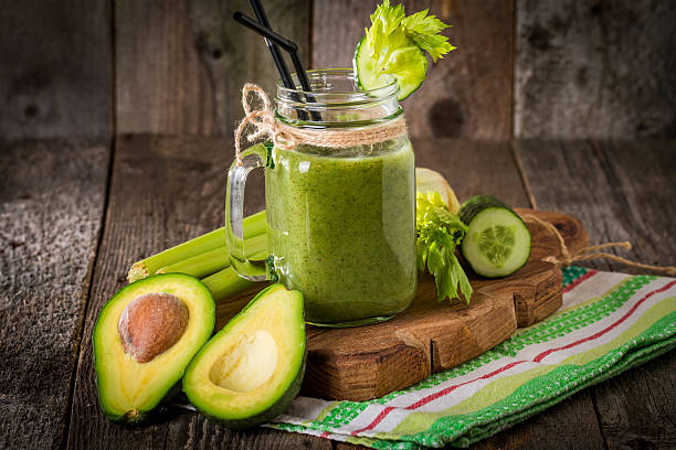 istock Healthy green juice smoothie with straw 506548576