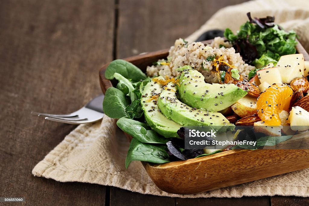Avocado and Quinoa Salad with Chia Seed Quinoa, avocado and apple salad. Perfect for the detox diet or just a healthy meal. Selective focus on front of dish with extreme shallow depth of field. Food Stock Photo