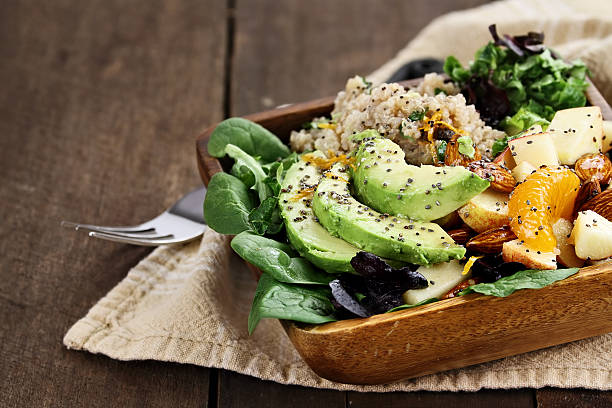 Avocado and Quinoa Salad with Chia Seed Quinoa, avocado and apple salad. Perfect for the detox diet or just a healthy meal. Selective focus on front of dish with extreme shallow depth of field. quinoa photos stock pictures, royalty-free photos & images