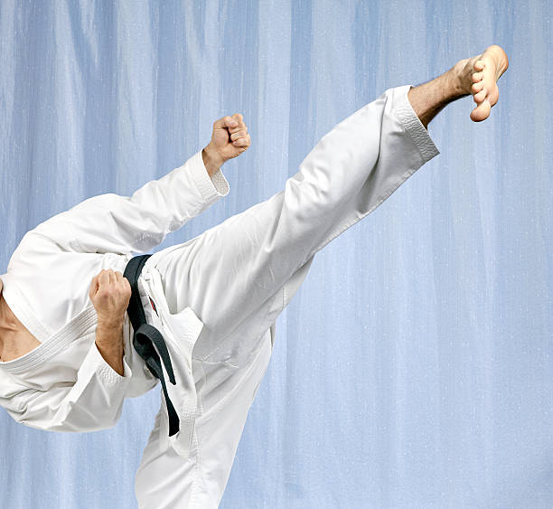 istock With black belt athlete is beating blow leg 506551404