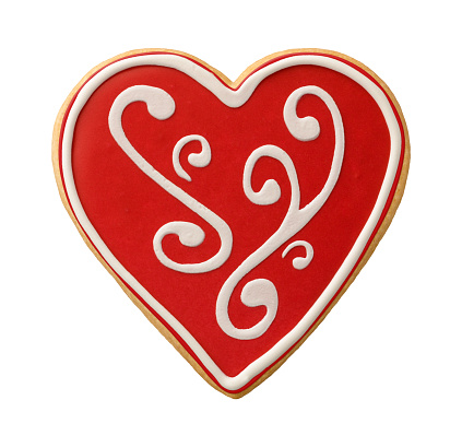 Heart Shaped Valentine Cookie isolated, with scroll work icing.