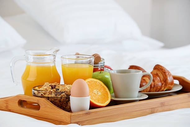 istock Breakfast in bed in hotel room. 506553116