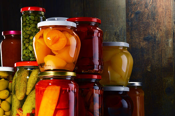 istock Jars with pickled vegetables, fruity compotes and jams 506553386