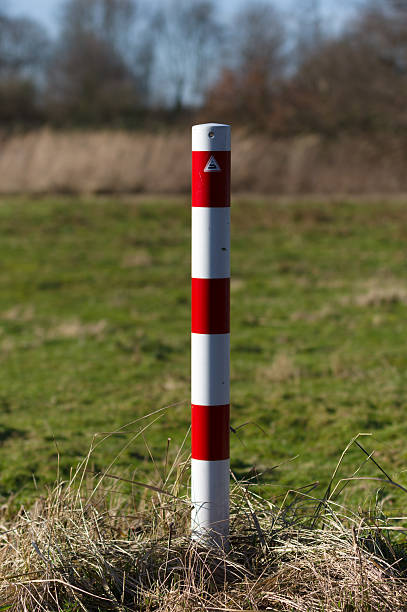 istock Striped red and white signal poles barricade 506556494