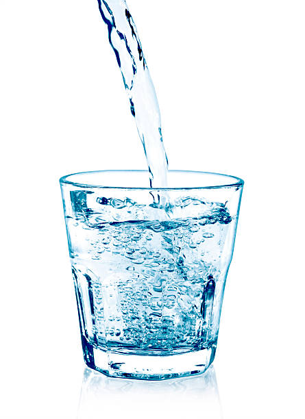 istock pouring water on a glass 506558208