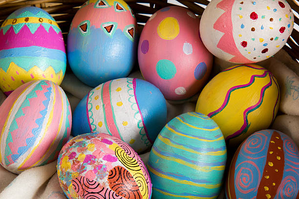 Easter Eggs colorful painted in bamboo basket stock photo