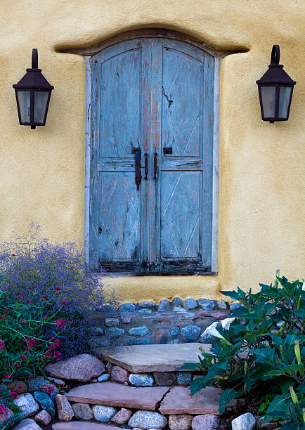istock Blue Southwest Door In Adobe Wall 506571899