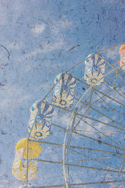 istock Vintage ferry wheel under bright blue sky 506573345