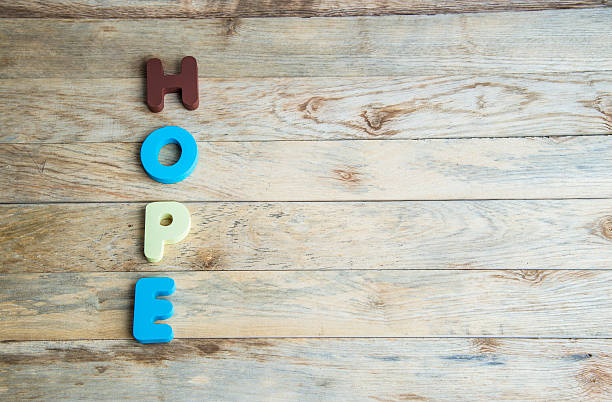 istock Colorful wooden word Hope on floor3 506574439
