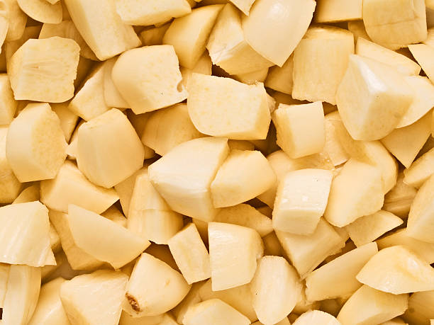 istock chopped uncooked raw garlic food background 506575167