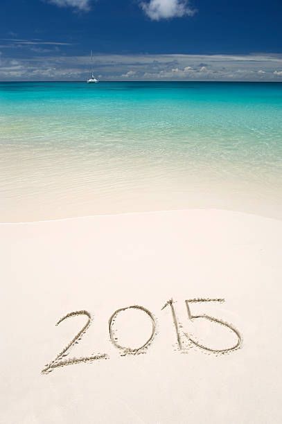 istock Handwritten 2015 Message on Bright Tropical Beach 506576535