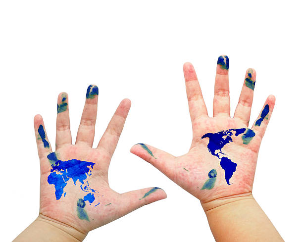 istock World map painted on children hands isolated on white background 506576767