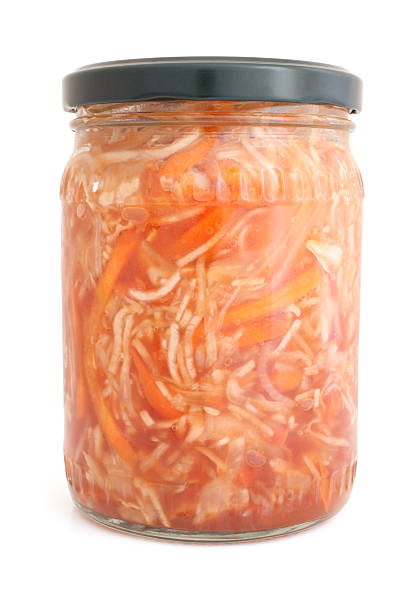 istock Preserved cabbage and carrot salad in glass jar 506577971