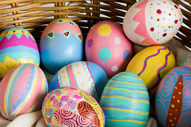 Easter Eggs colorful painted in bamboo basket stock photo