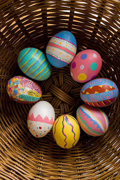 Easter Eggs colorful painted in bamboo basket stock photo