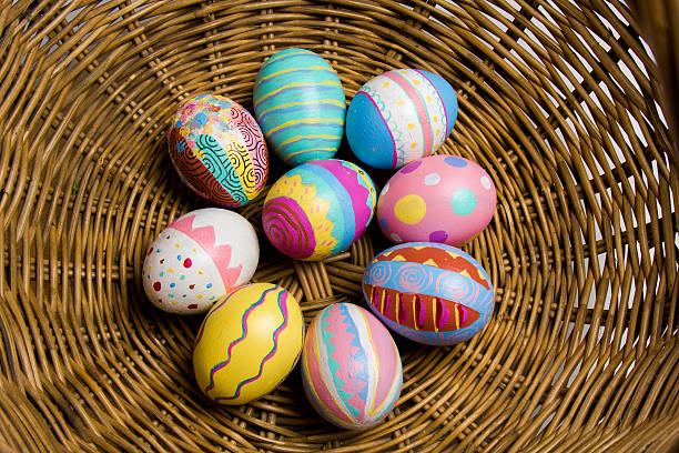 Easter Eggs colorful painted in bamboo basket stock photo