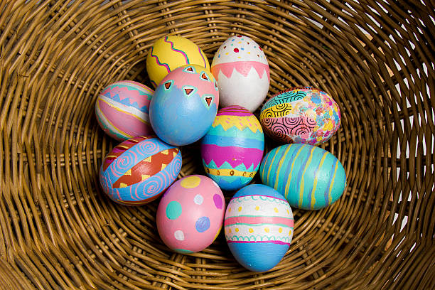 Easter Eggs colorful painted in bamboo basket stock photo