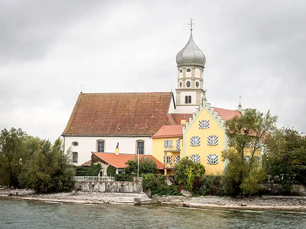 Picture of the church Sanct Georg in Wasserburg at the lake Bodensee on a cloudy and rainy day