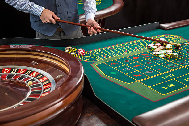 istock Roulette and piles of gambling chips on a green table. 506583874
