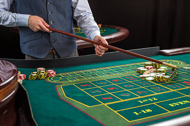 istock Roulette and piles of gambling chips on a green table. 506583922