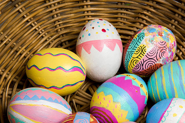 Easter Eggs colorful painted in bamboo basket stock photo