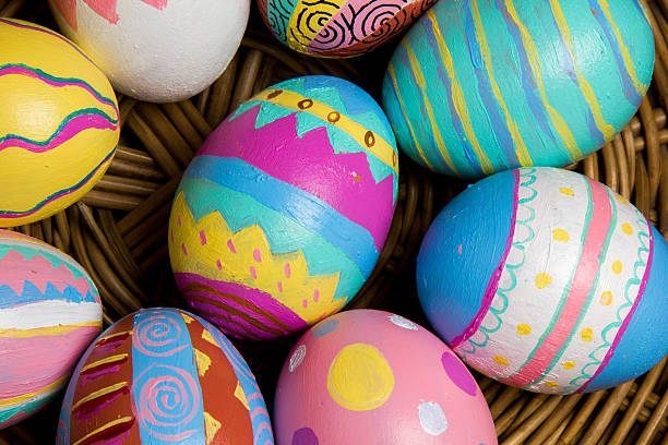 Easter Eggs colorful painted in bamboo basket stock photo