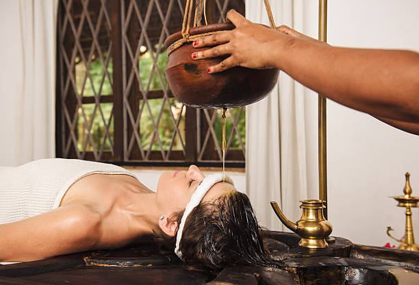 istock Ayurvedic shirodhara treatment in India 506584980