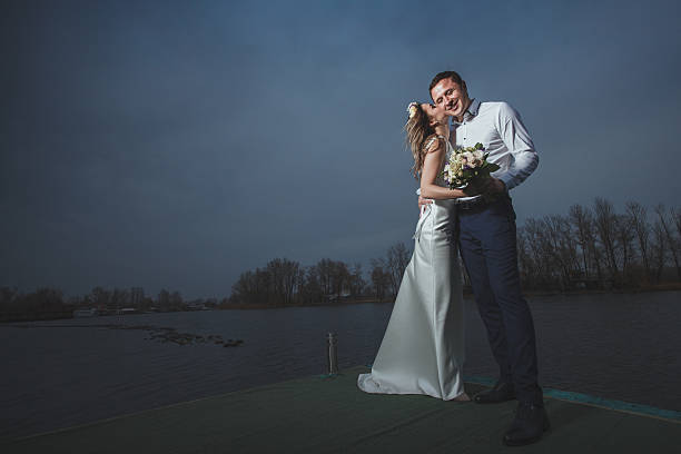 istock pier bride groom night 506585286