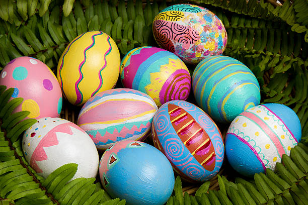 Easter Eggs colorful painted with green fern stock photo