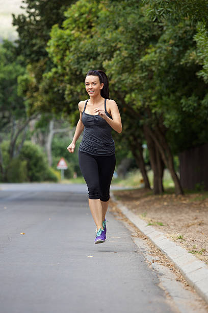 istock Young woman running exercise outdoors 506585380