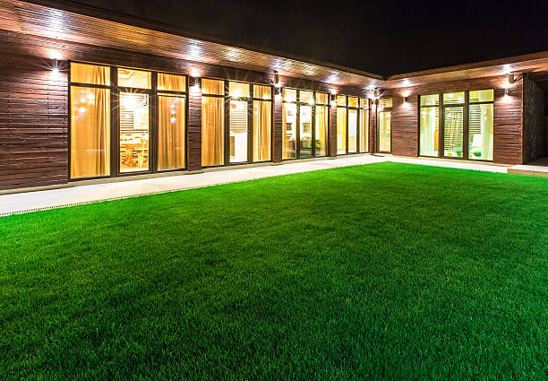istock Detached house at night view from outside the rear courtyard. 506585452