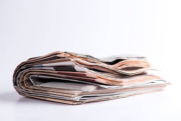 istock Folded Newspapers isolated on white background 506585496