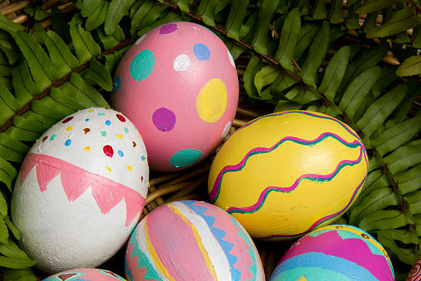 Easter Eggs colorful painted with green fern stock photo